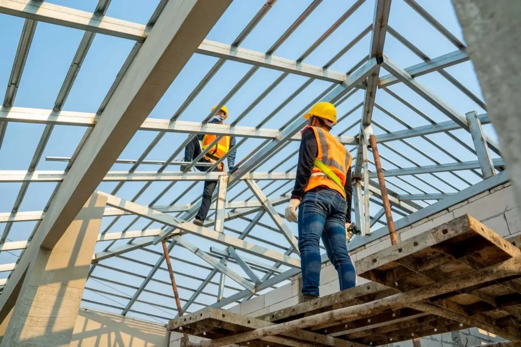 Construction workers building a roof